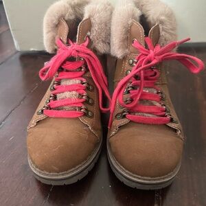 Fur boots with red laces